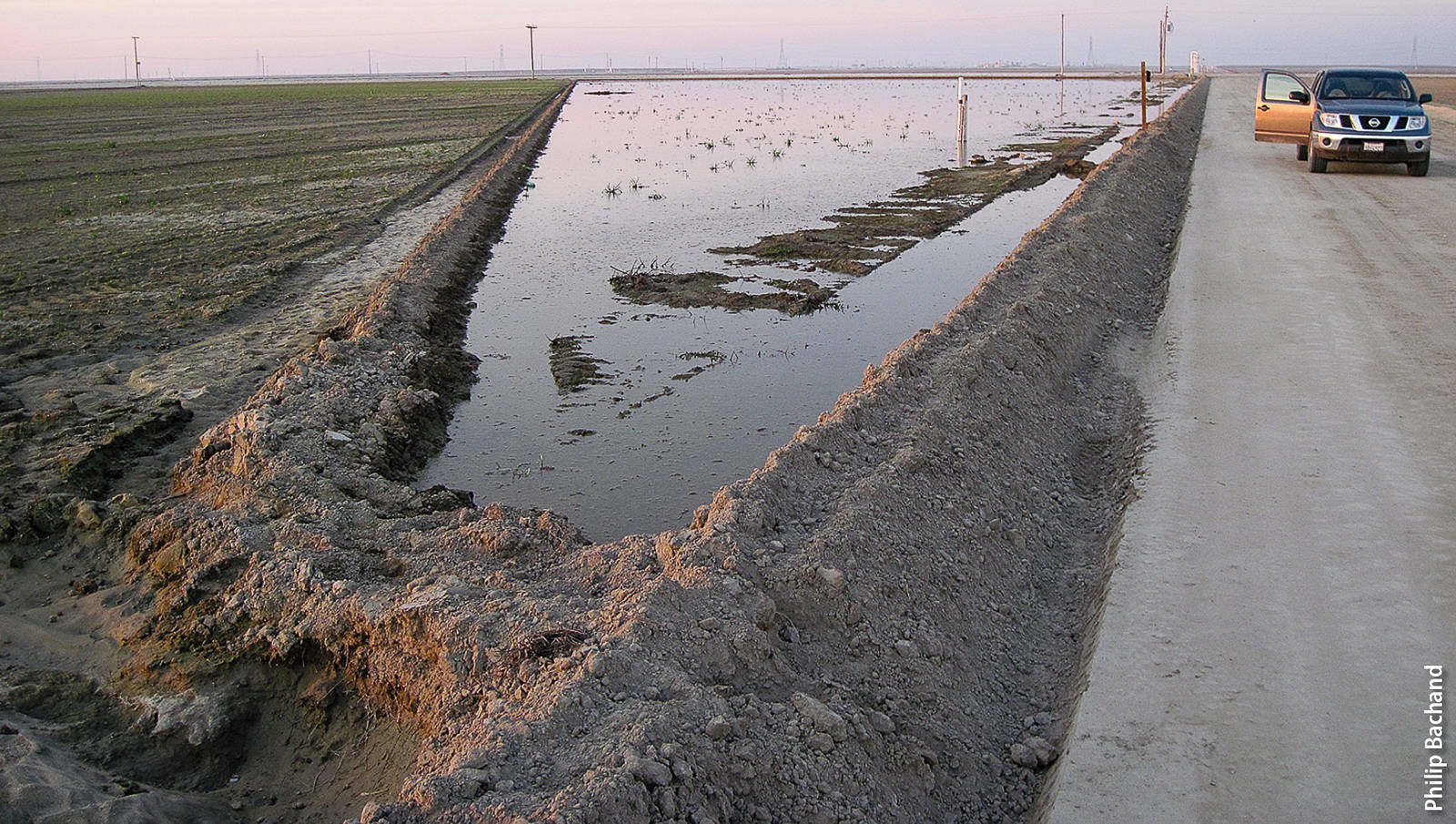 Wintertime modifications to tomato field to manage water were similar to rice checks to enable capture and infiltration of flood flows. Modifications included cutting small check berms to accommodate field gradients and installing low cost flashboard risers to manage water flow and elevations.