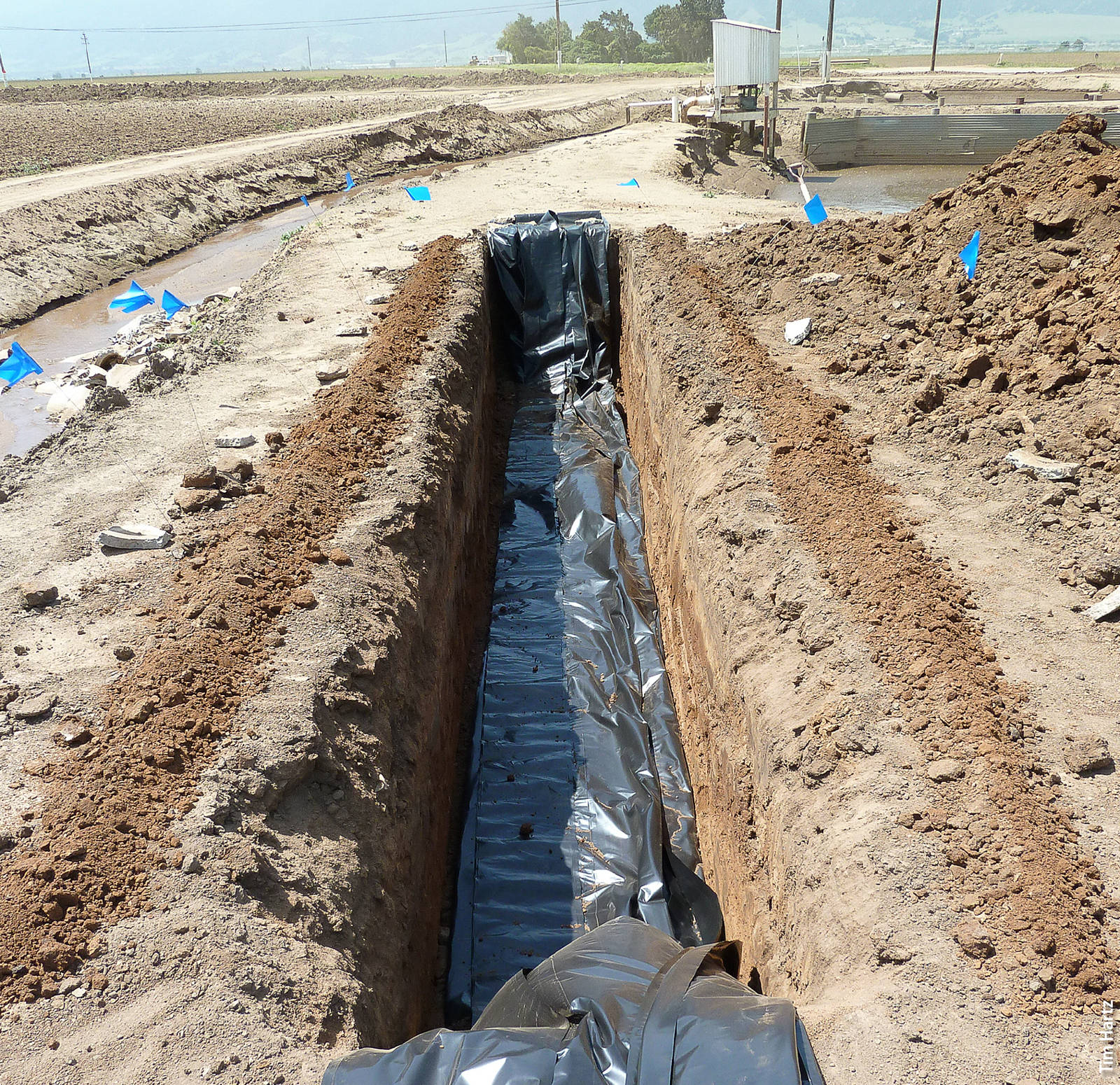 The denitrification bioreactor was dug with a backhoe and fitted with a polyethylene liner.
