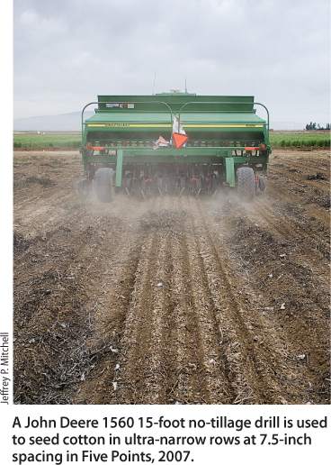 A John Deere 1560 15-foot no-tillage drill is used to seed cotton in ultra-narrow rows at 7.5-inch spacing in Five Points, 2007.