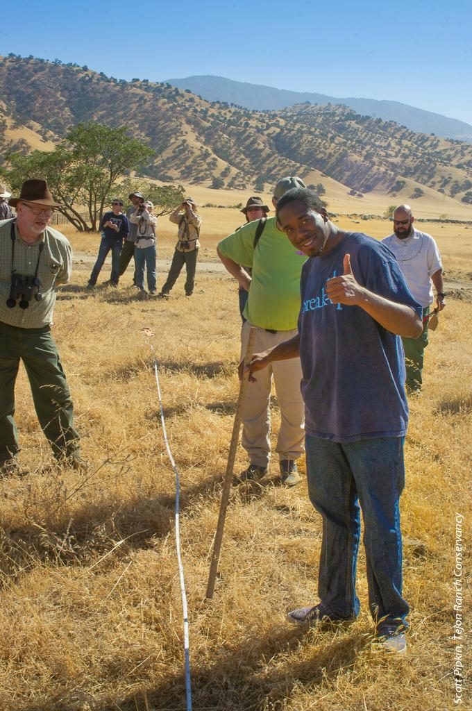 Tejon Ranch Conservancy volunteer Deonsa Taylor measures residual dry matter on rangeland, which will help manage grazing on this working cattle ranch.