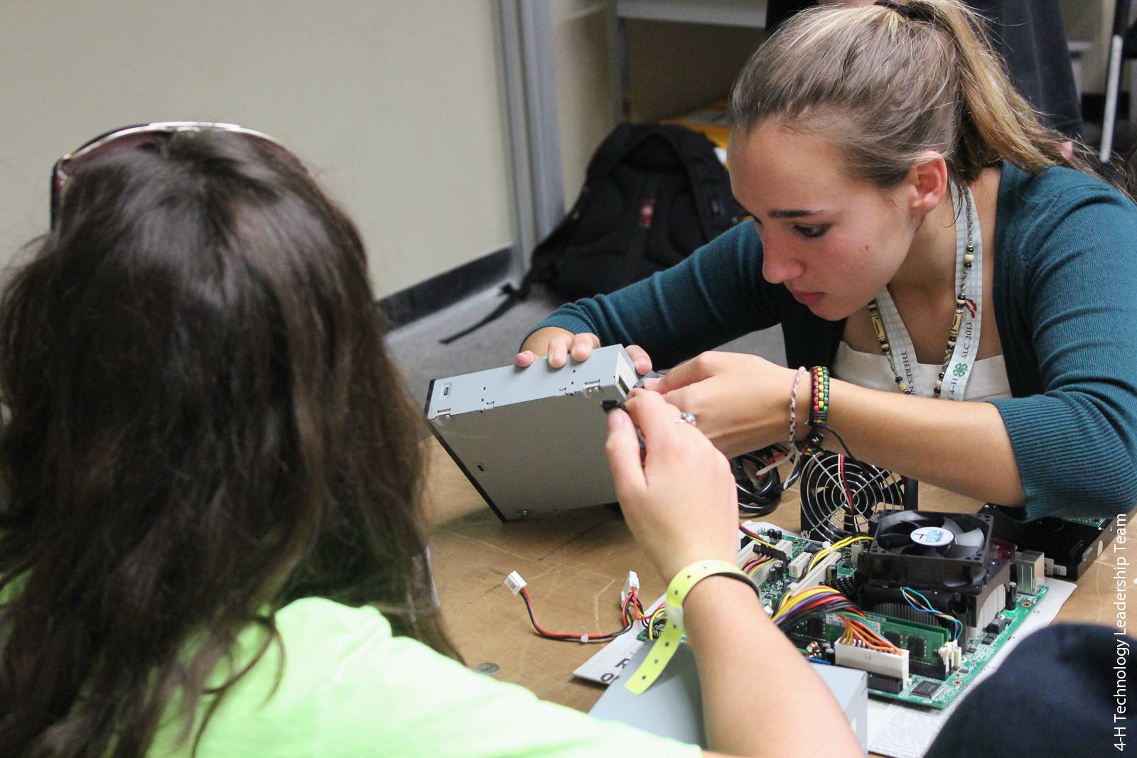 Nonformal education programs such as 4-H have become recognized as a vital link in addressing scientific literacy. Above, students participate in a computer hardware workshop at the California 4-H State Leadership Conference.